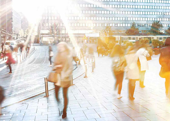Image of city with buildings and people walking