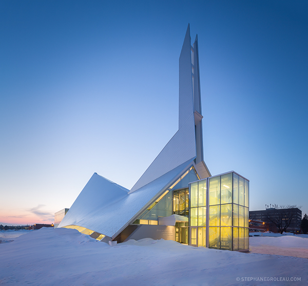 modern library that looks like a church, outside view with snow on the ground